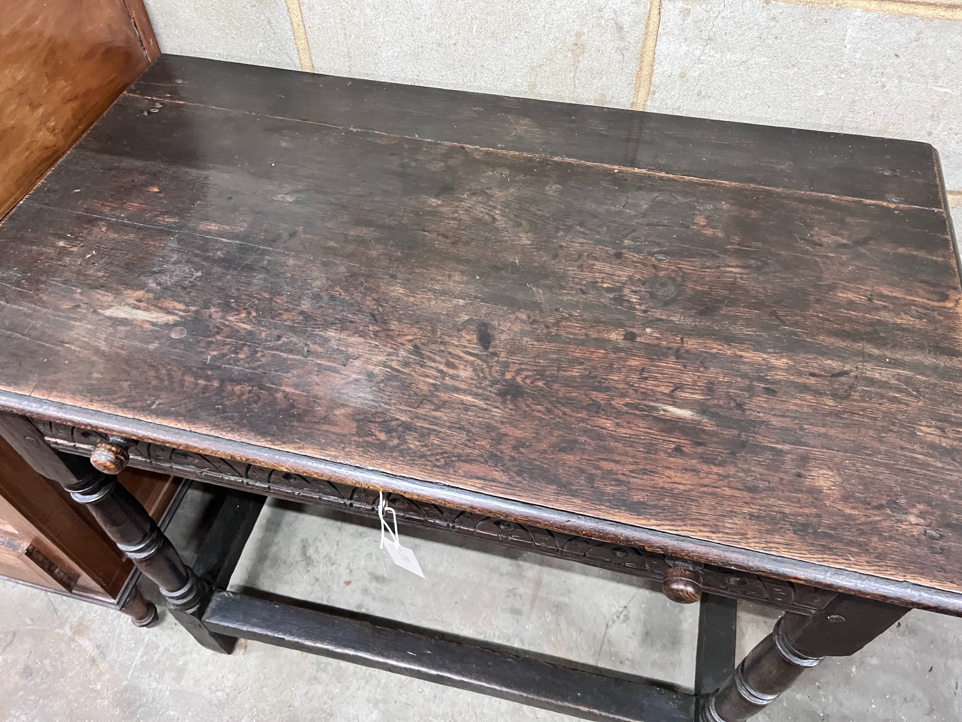 A 17th century style oak side table, width 100cm *Please note the sale commences at 9am.